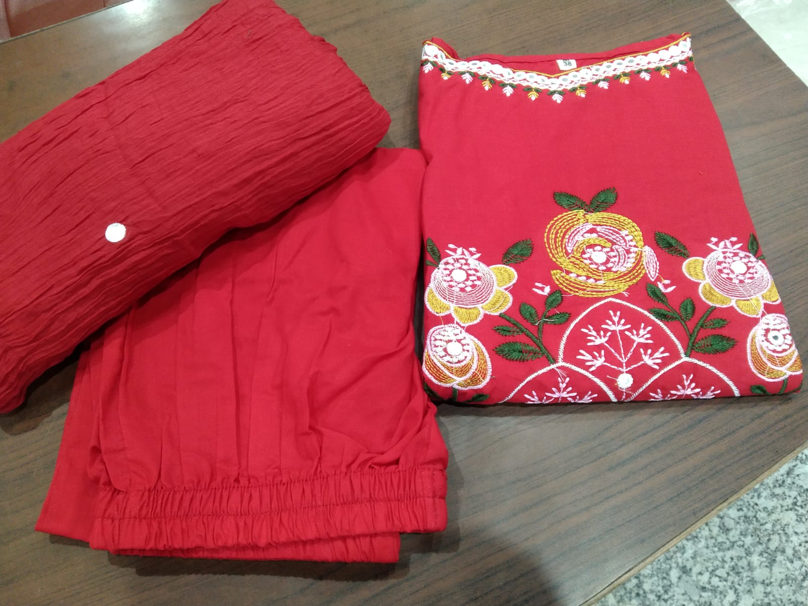 Premium cotton embroidered sleeveless kurti set with elegant festive detailing