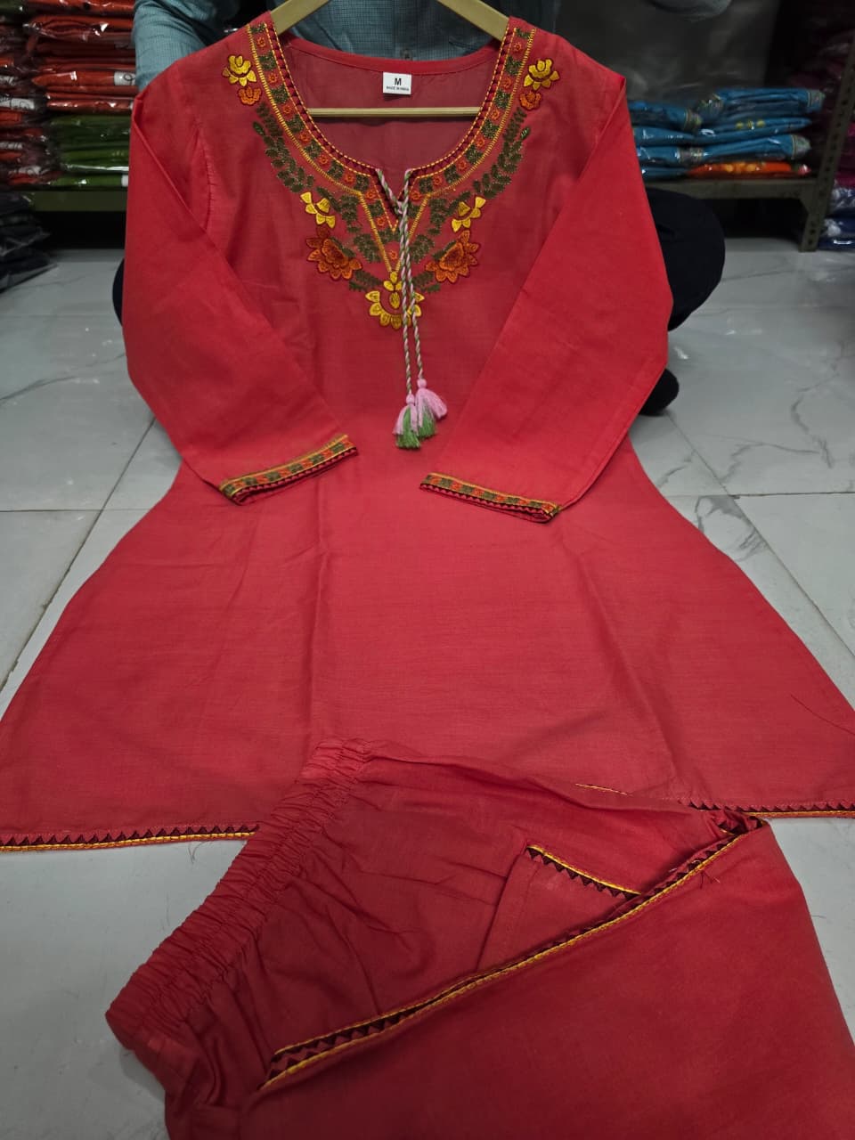 Premium embroidered co-ord set with tassel detailing and coordinated kurti and pant